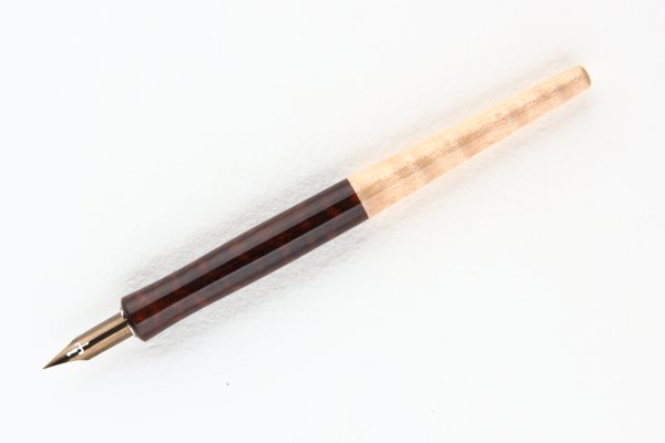 Straight pen holder made of Snakewood and Curly Sycamore Maple wood.